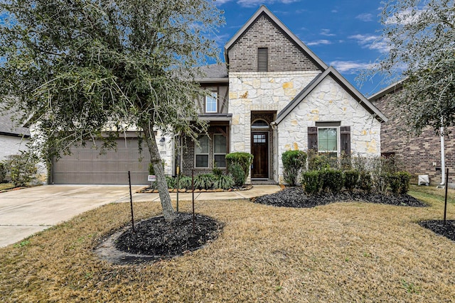 view of front facade with a garage and a front yard