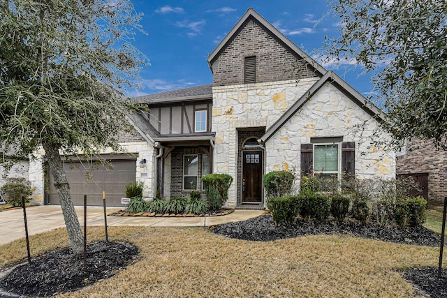 view of front of house featuring a garage and a front yard