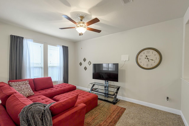 living room with ceiling fan and carpet flooring