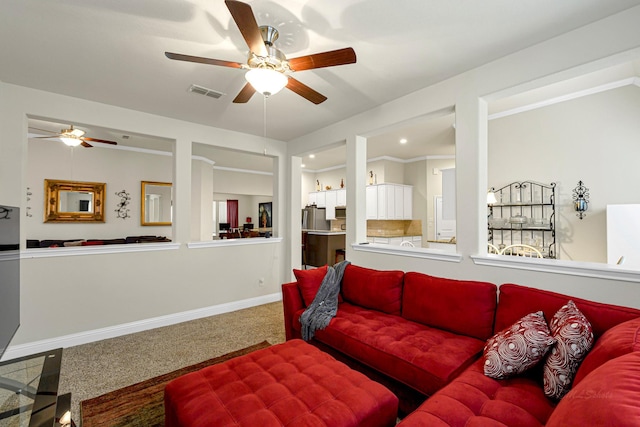 carpeted living room featuring ceiling fan