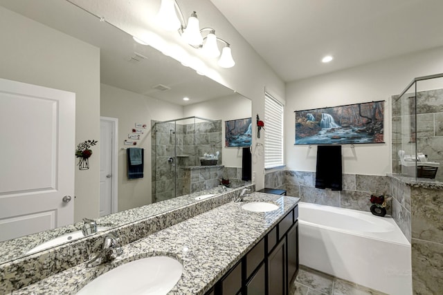 bathroom featuring vanity and separate shower and tub