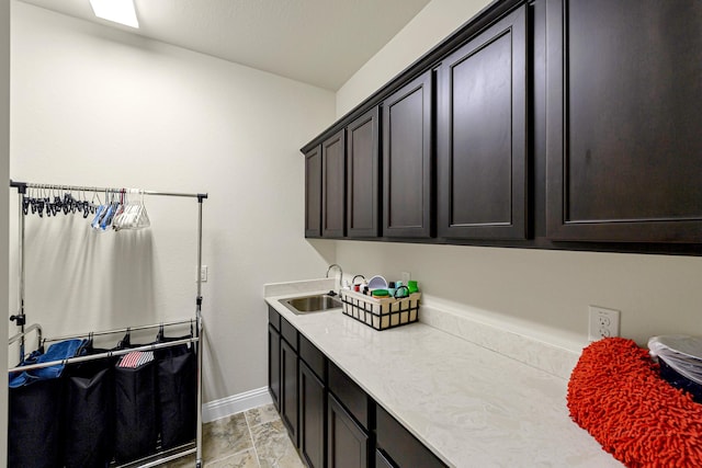 clothes washing area with sink