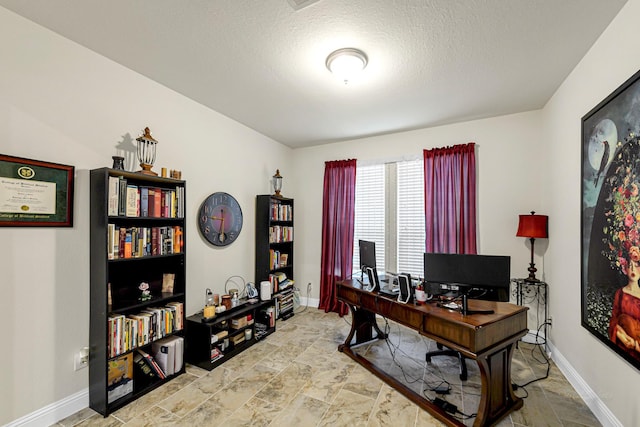 office area featuring a textured ceiling