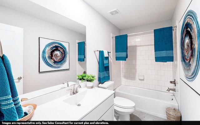 full bathroom with vanity, toilet, and tiled shower / bath combo