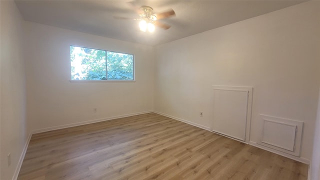 unfurnished room featuring light hardwood / wood-style floors and ceiling fan