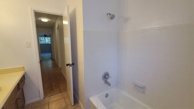 bathroom featuring vanity, tile patterned floors, and shower / tub combination