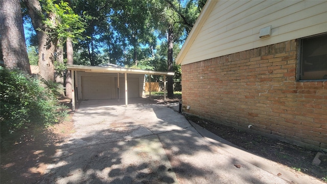 view of side of property with a garage and an outdoor structure