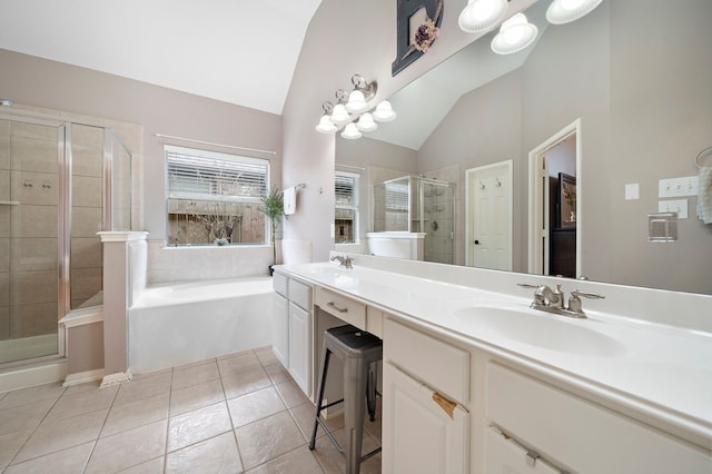 bathroom featuring lofted ceiling, tile patterned floors, separate shower and tub, and vanity