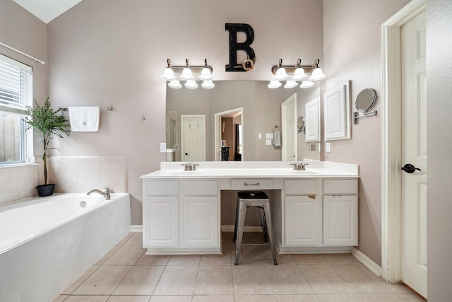 bathroom with vanity, tile patterned floors, and independent shower and bath