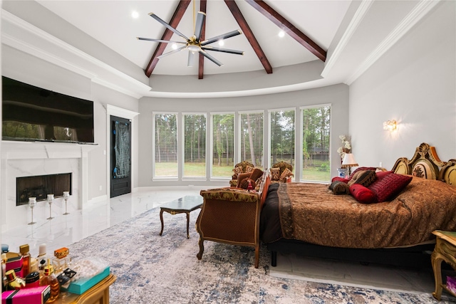 bedroom featuring lofted ceiling with beams, a premium fireplace, and ceiling fan