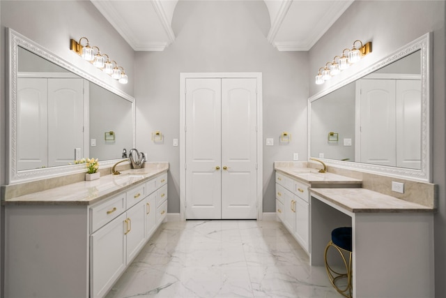 bathroom with ornamental molding and vanity