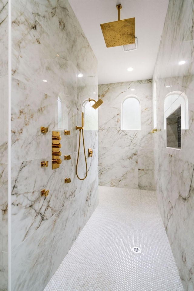 bathroom featuring a tile shower