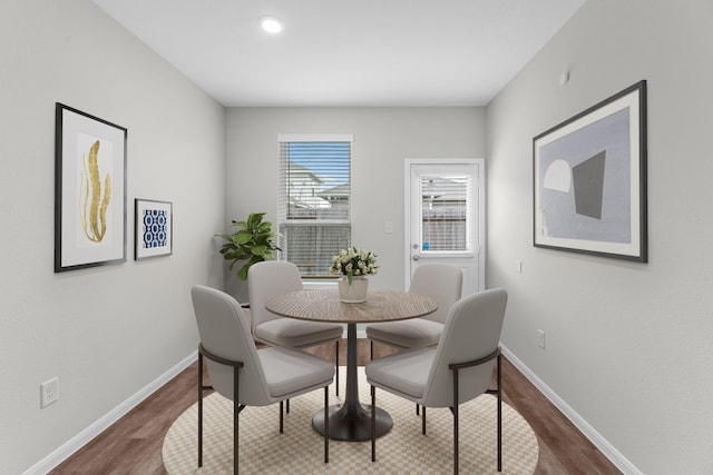 dining area with dark wood-type flooring