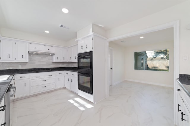 kitchen with decorative backsplash, white cabinets, and black appliances