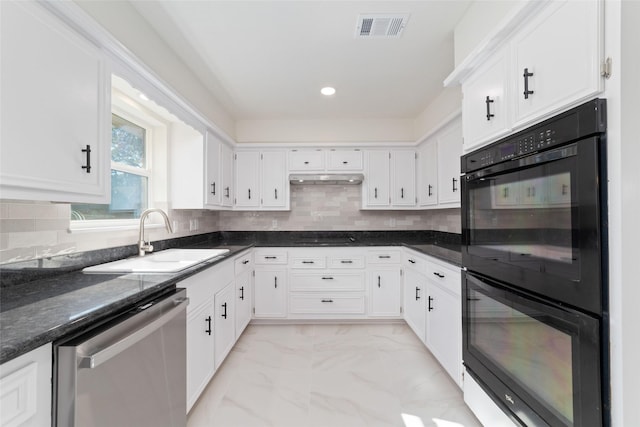 kitchen featuring dark stone countertops, sink, black appliances, and white cabinets