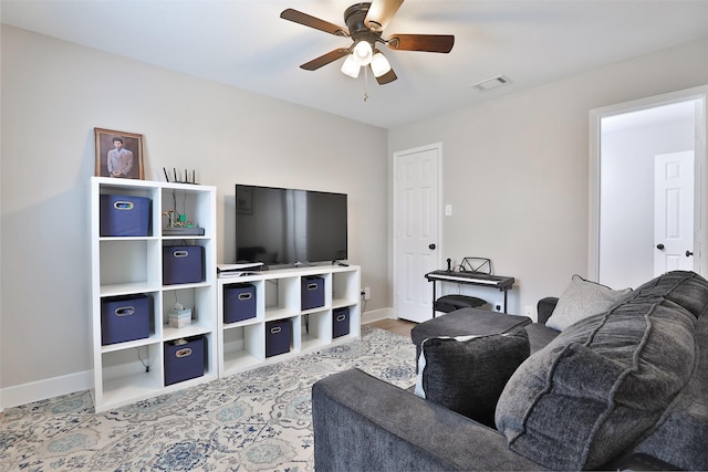 living room featuring ceiling fan