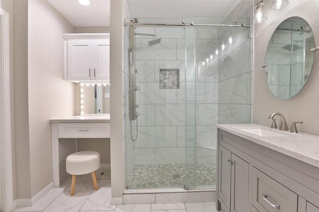 bathroom featuring an enclosed shower and vanity