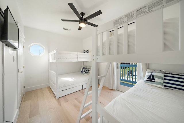 bedroom with light hardwood / wood-style floors and ceiling fan