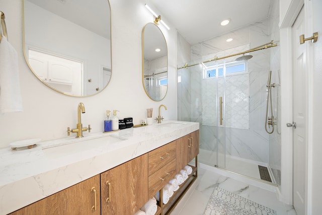 bathroom featuring vanity and a shower with shower door