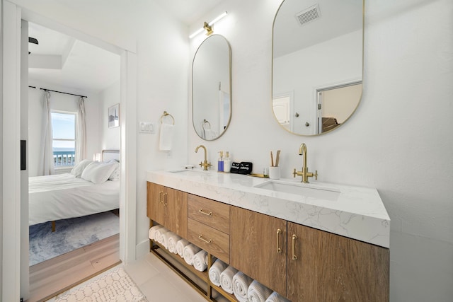 bathroom featuring hardwood / wood-style flooring and vanity