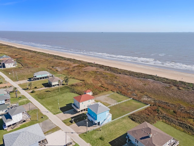 bird's eye view with a water view and a view of the beach