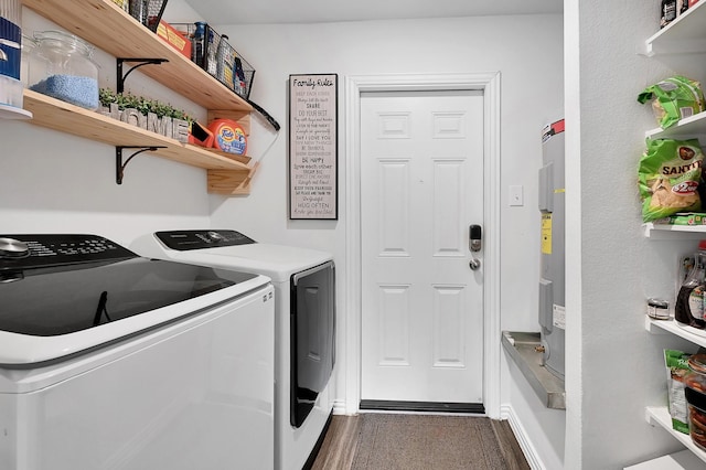 washroom featuring dark wood-type flooring and washer and dryer