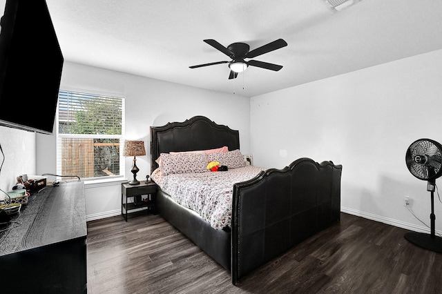 bedroom with dark wood-type flooring and ceiling fan