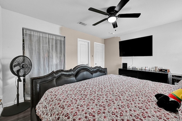 bedroom featuring hardwood / wood-style flooring and ceiling fan