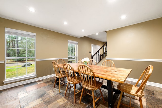 dining space featuring ornamental molding