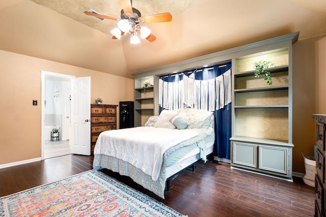 bedroom with ceiling fan, lofted ceiling, and dark hardwood / wood-style flooring