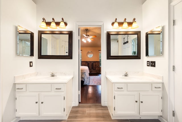 bathroom with vanity and hardwood / wood-style floors