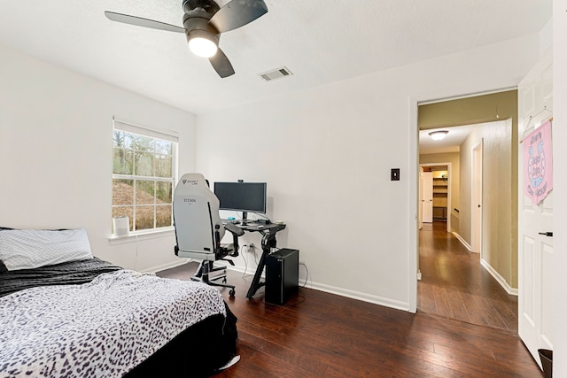 bedroom featuring ceiling fan and dark hardwood / wood-style floors