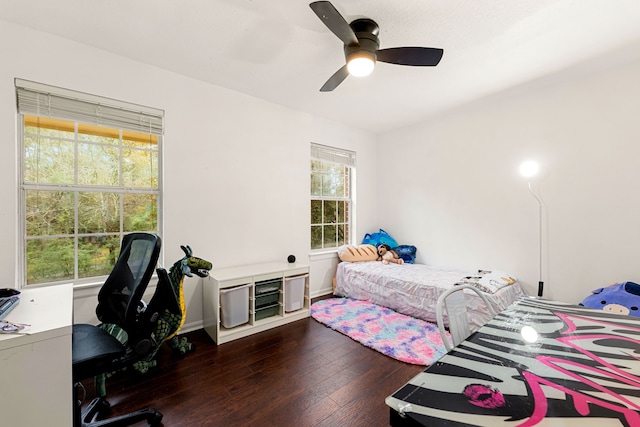 bedroom featuring dark hardwood / wood-style flooring and ceiling fan