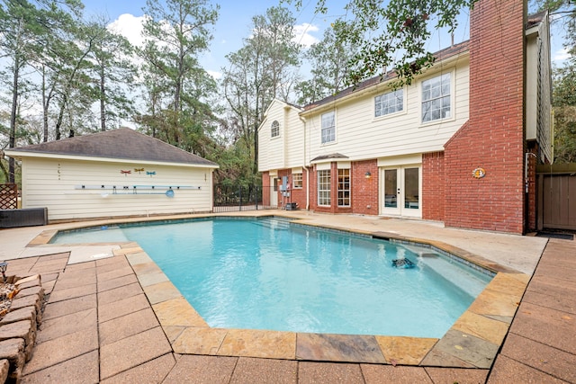 view of pool with a patio and french doors