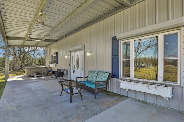 view of patio featuring a hot tub and ceiling fan