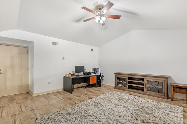 home office with ceiling fan, wood-type flooring, and vaulted ceiling