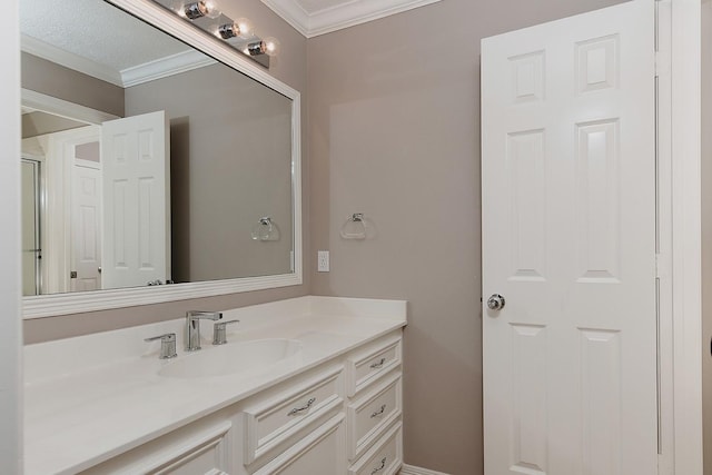 bathroom featuring ornamental molding and vanity