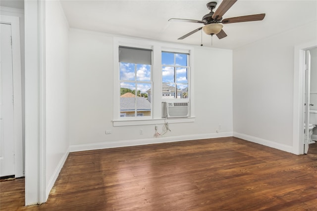 unfurnished room featuring ceiling fan, cooling unit, and dark hardwood / wood-style flooring