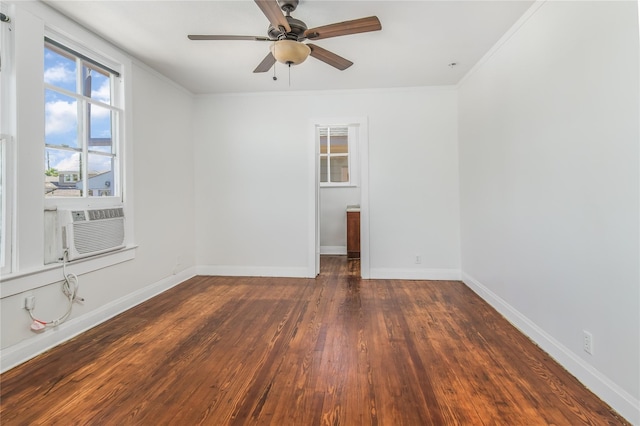 unfurnished room with ornamental molding, cooling unit, ceiling fan, and dark hardwood / wood-style flooring