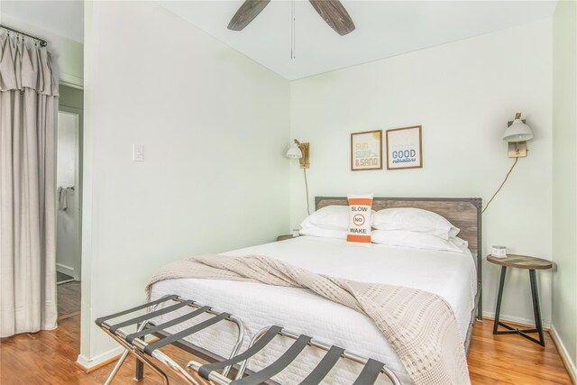 bedroom featuring hardwood / wood-style floors and ceiling fan