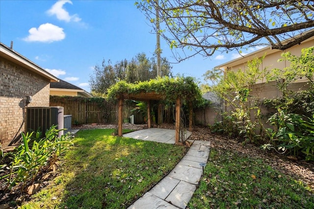 view of yard featuring a patio and central air condition unit