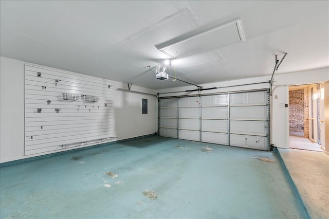 garage featuring a garage door opener and electric panel