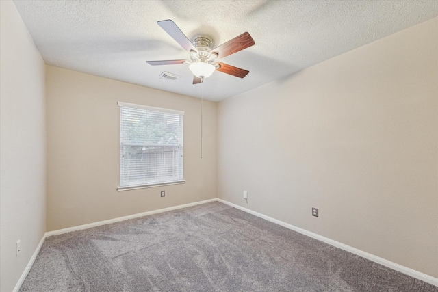 carpeted empty room featuring a textured ceiling and ceiling fan