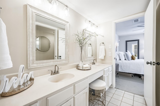 bathroom featuring ceiling fan, vanity, and tile patterned flooring