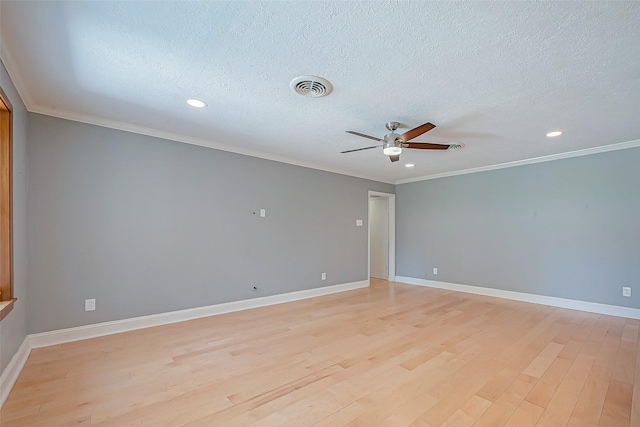 unfurnished room with ceiling fan, ornamental molding, a textured ceiling, and light wood-type flooring