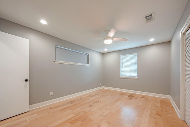 unfurnished room with light hardwood / wood-style floors and ceiling fan