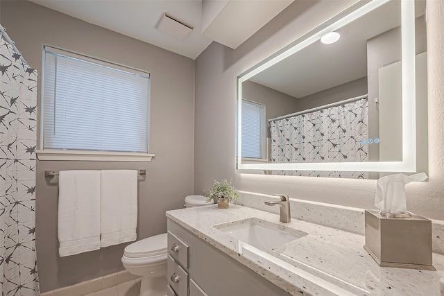 bathroom with vanity and toilet