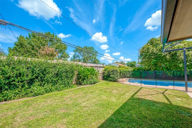 view of yard featuring a fenced in pool