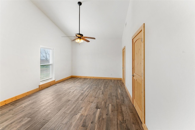 unfurnished room featuring hardwood / wood-style flooring, high vaulted ceiling, and ceiling fan