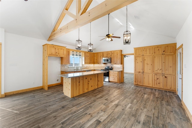 kitchen featuring a center island, stainless steel appliances, dark hardwood / wood-style flooring, and tasteful backsplash